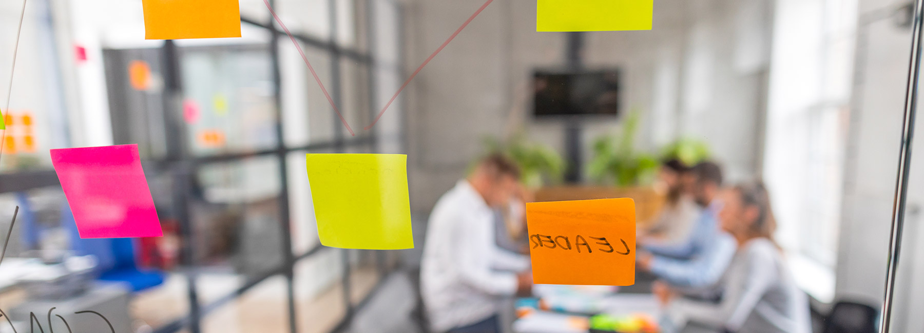 A meeting room with sticky notes on the wall