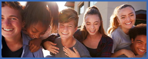 A group of young people laughing and enjoying each other's company